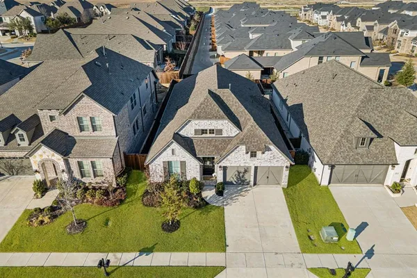 an aerial view of a house with swimming pool