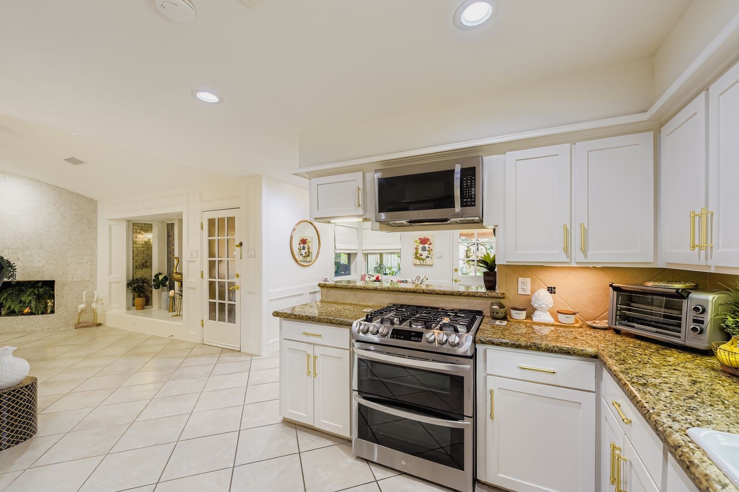 610 Andover Street Spring, TX 77373 - Photo 12 of 26 a kitchen with a stove and a microwave