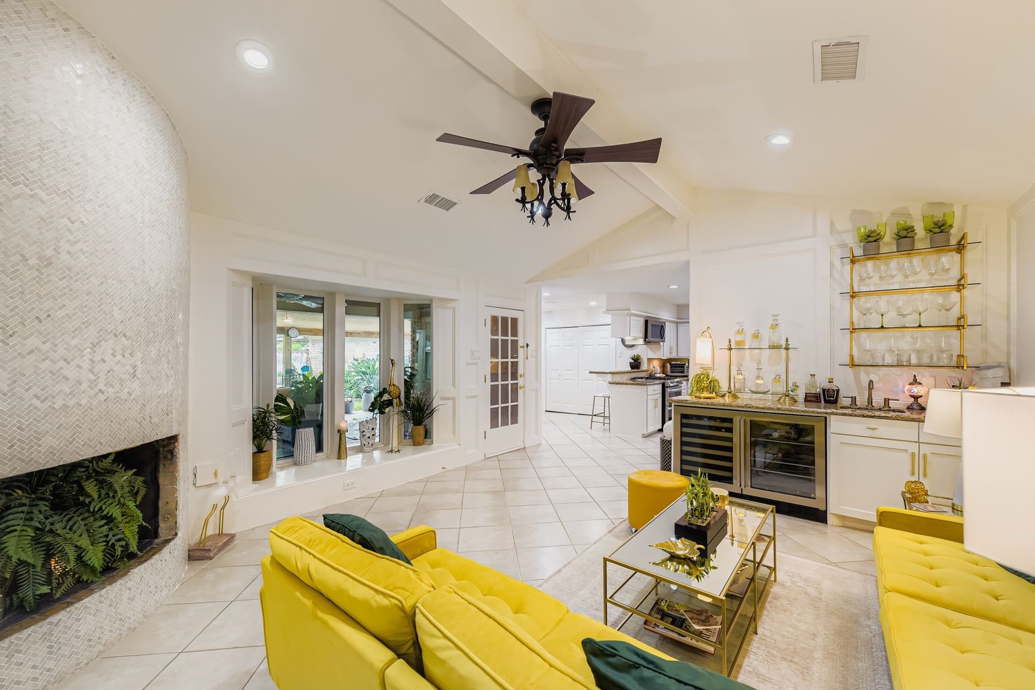 610 Andover Street Spring, TX 77373 - Photo 15 of 26 a living room with furniture kitchen view and a fireplace