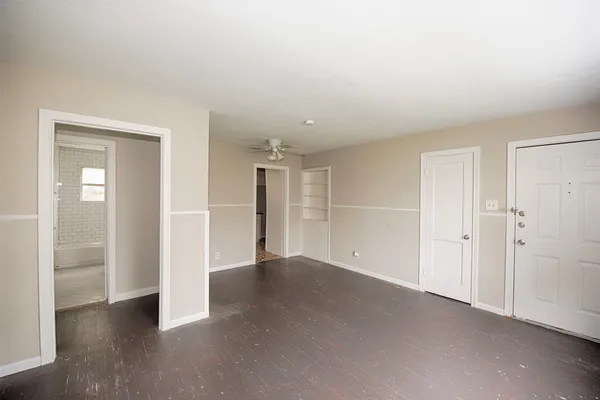 an empty room with closet area