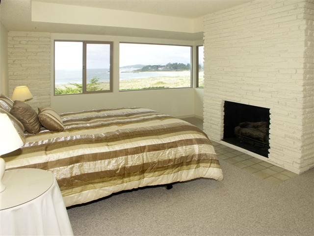 2705 Ribera Road Carmel, CA 93923 - Photo 17 of 22 a bedroom with a bed and a window
