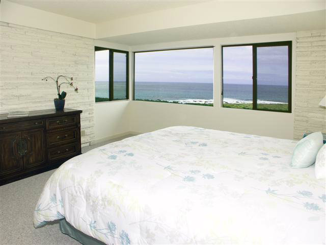 2705 Ribera Road Carmel, CA 93923 - Photo 19 of 22 a bedroom with a large bed and a large window