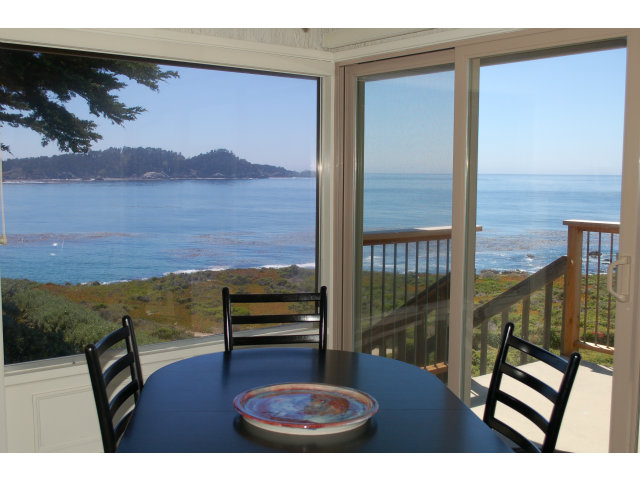 2705 Ribera Road Carmel, CA 93923 - Photo 8 of 22 a view of a balcony with chair and wooden floor