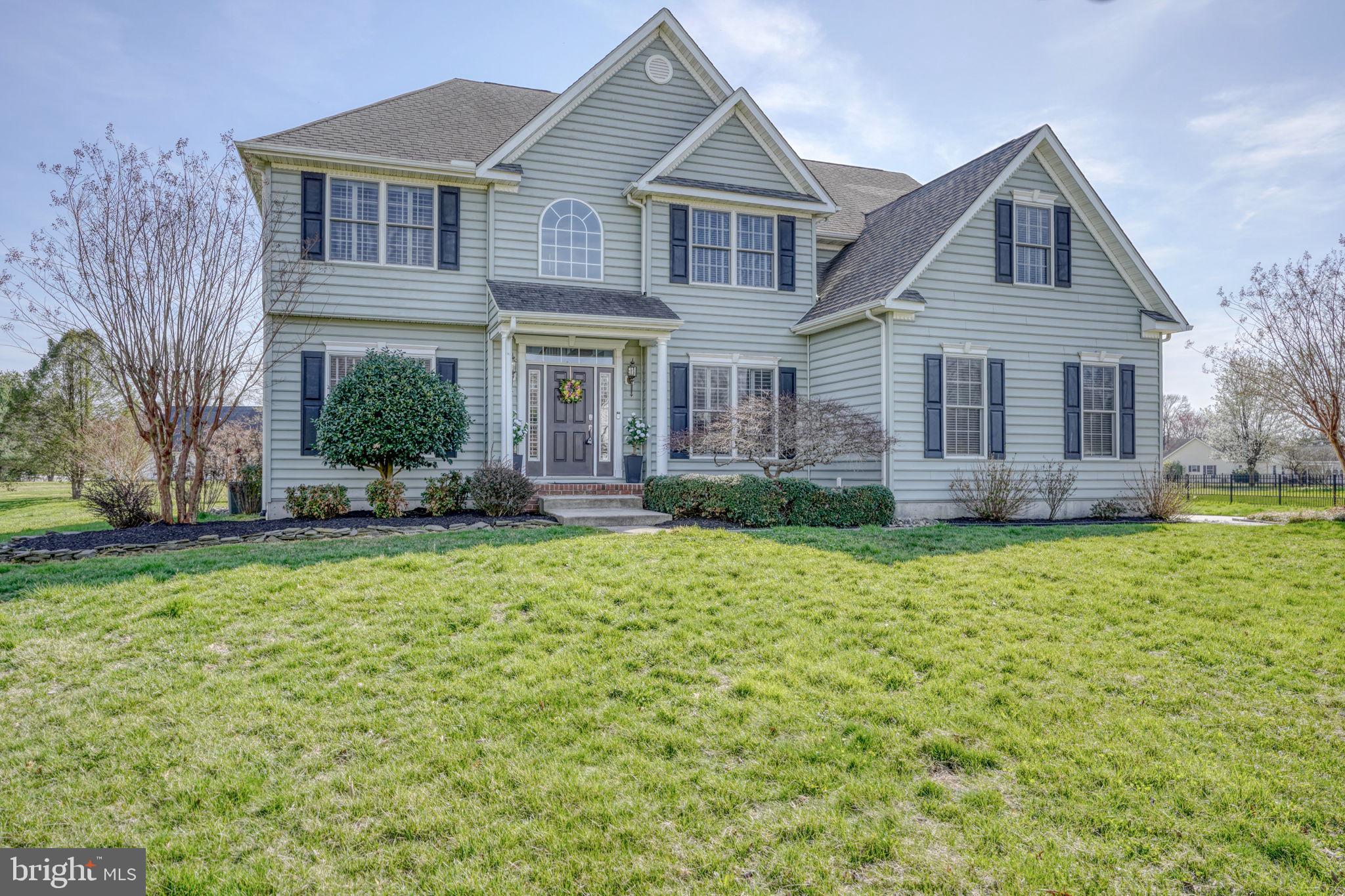 210 Grapevine Way Milford, DE 19963 - Photo 11 of 61 a front view of a house with garden