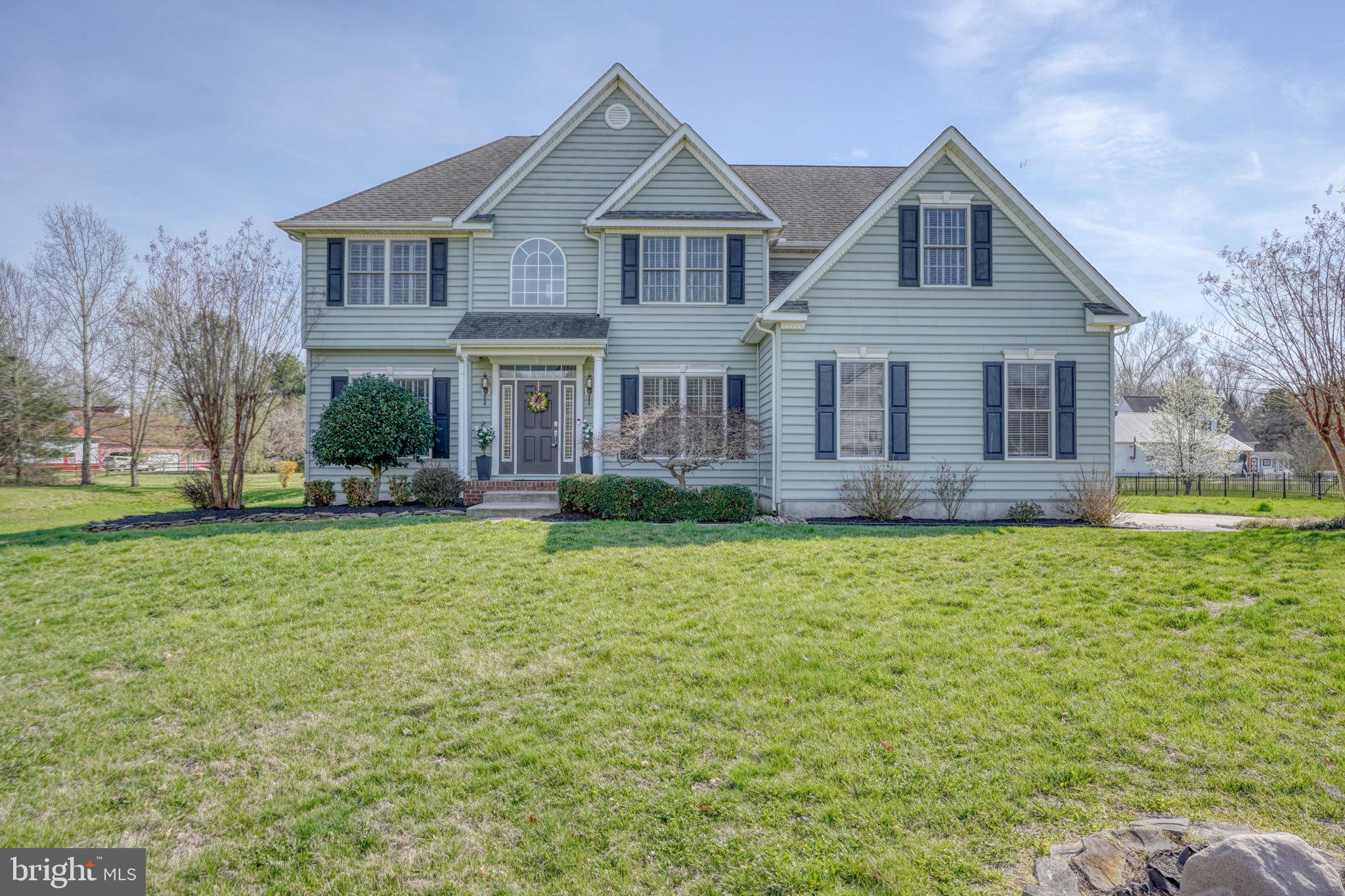 210 Grapevine Way Milford, DE 19963 - Photo 12 of 61 a front view of house with yard and trees