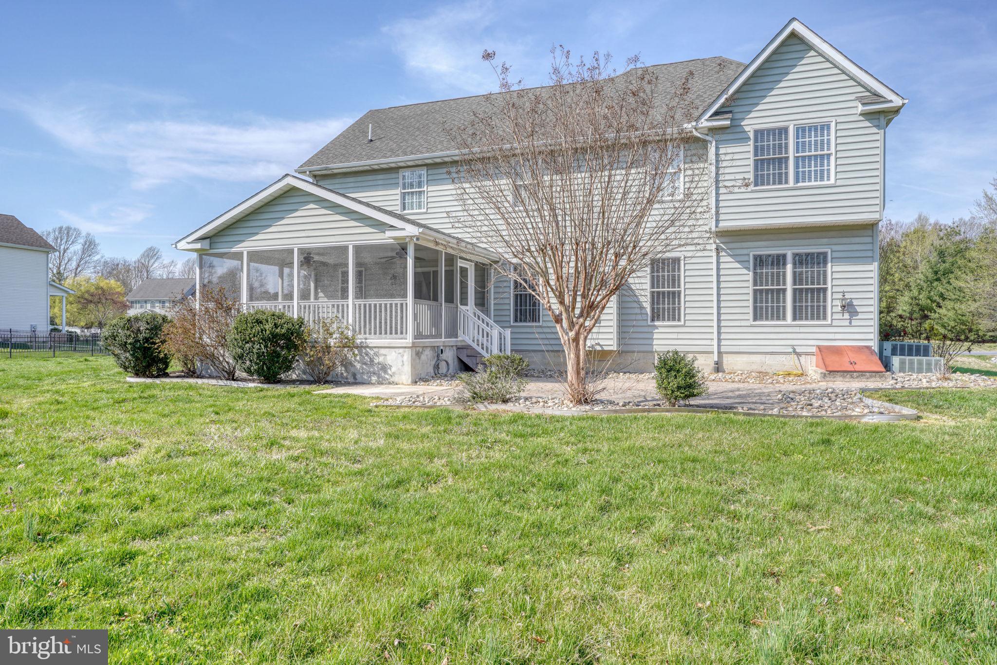 210 Grapevine Way Milford, DE 19963 - Photo 14 of 61 a front view of a house with a yard
