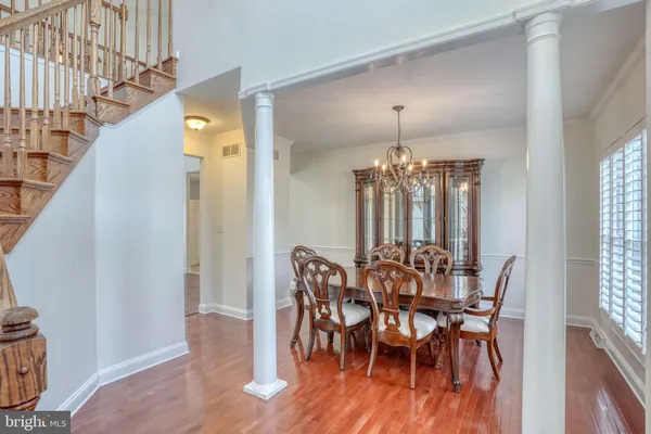 a view of a dining room with furniture and window