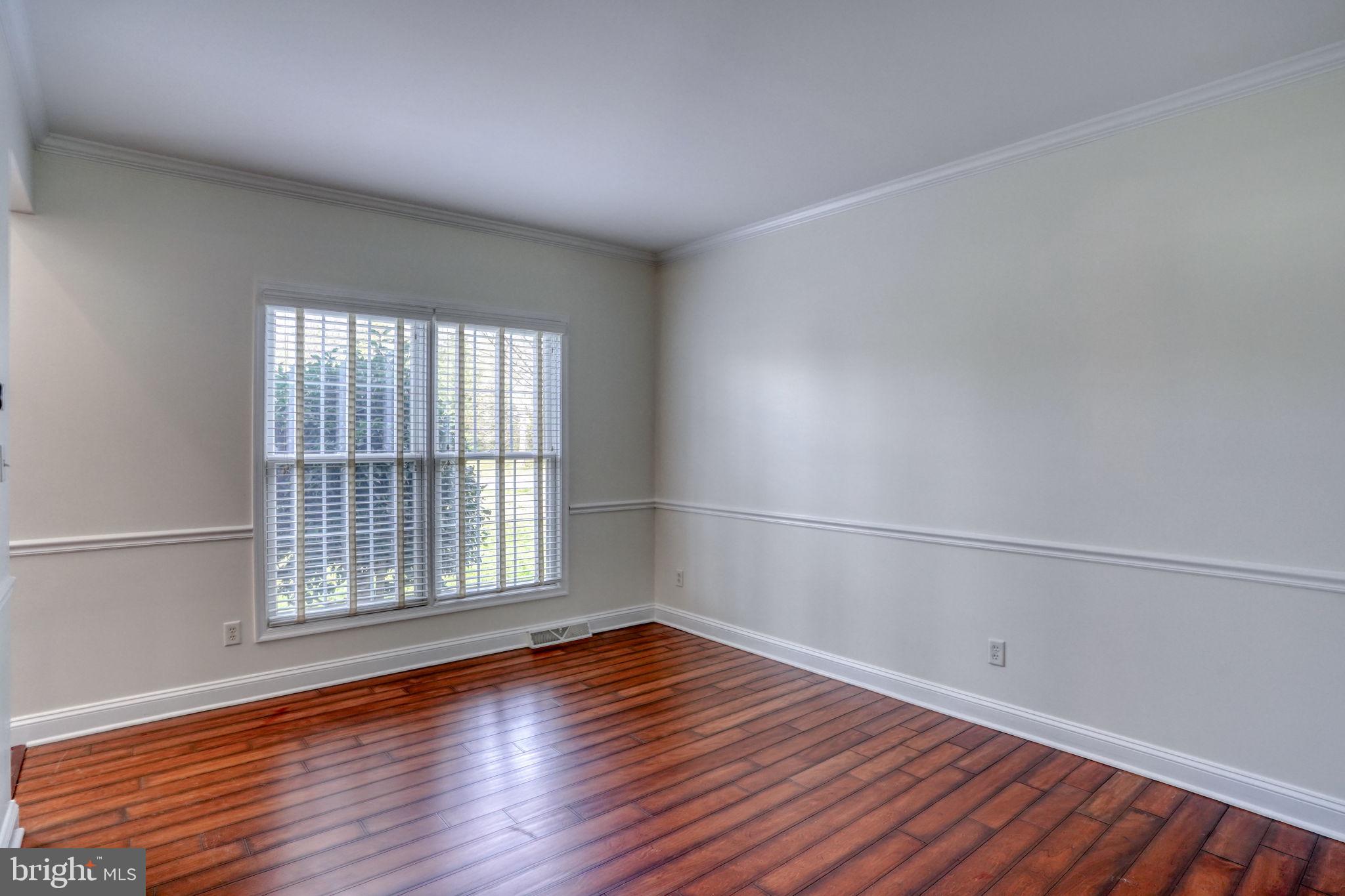 210 Grapevine Way Milford, DE 19963 - Photo 27 of 61 wooden floor in an empty room with a window
