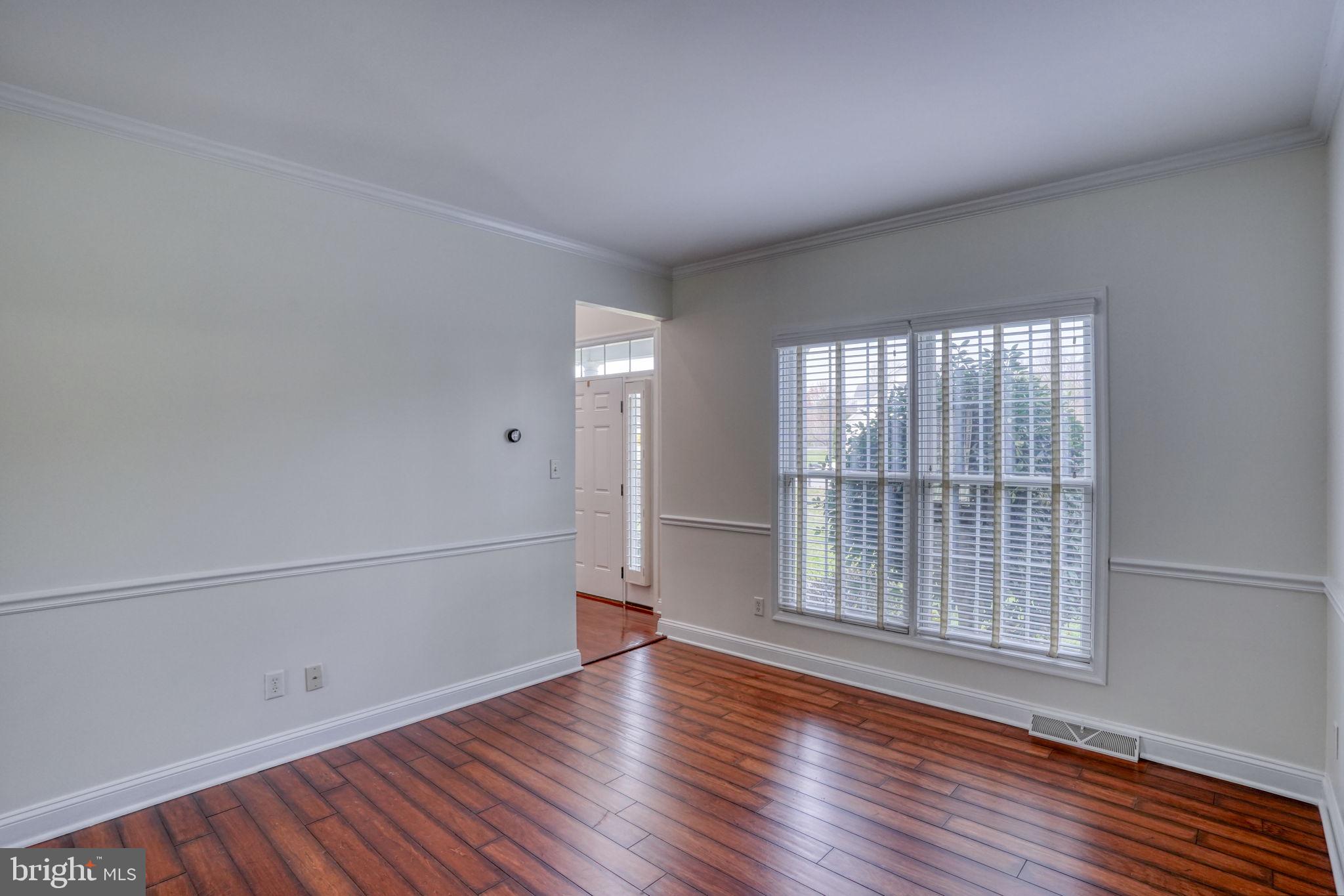 210 Grapevine Way Milford, DE 19963 - Photo 28 of 61 wooden floor in an empty room with a window