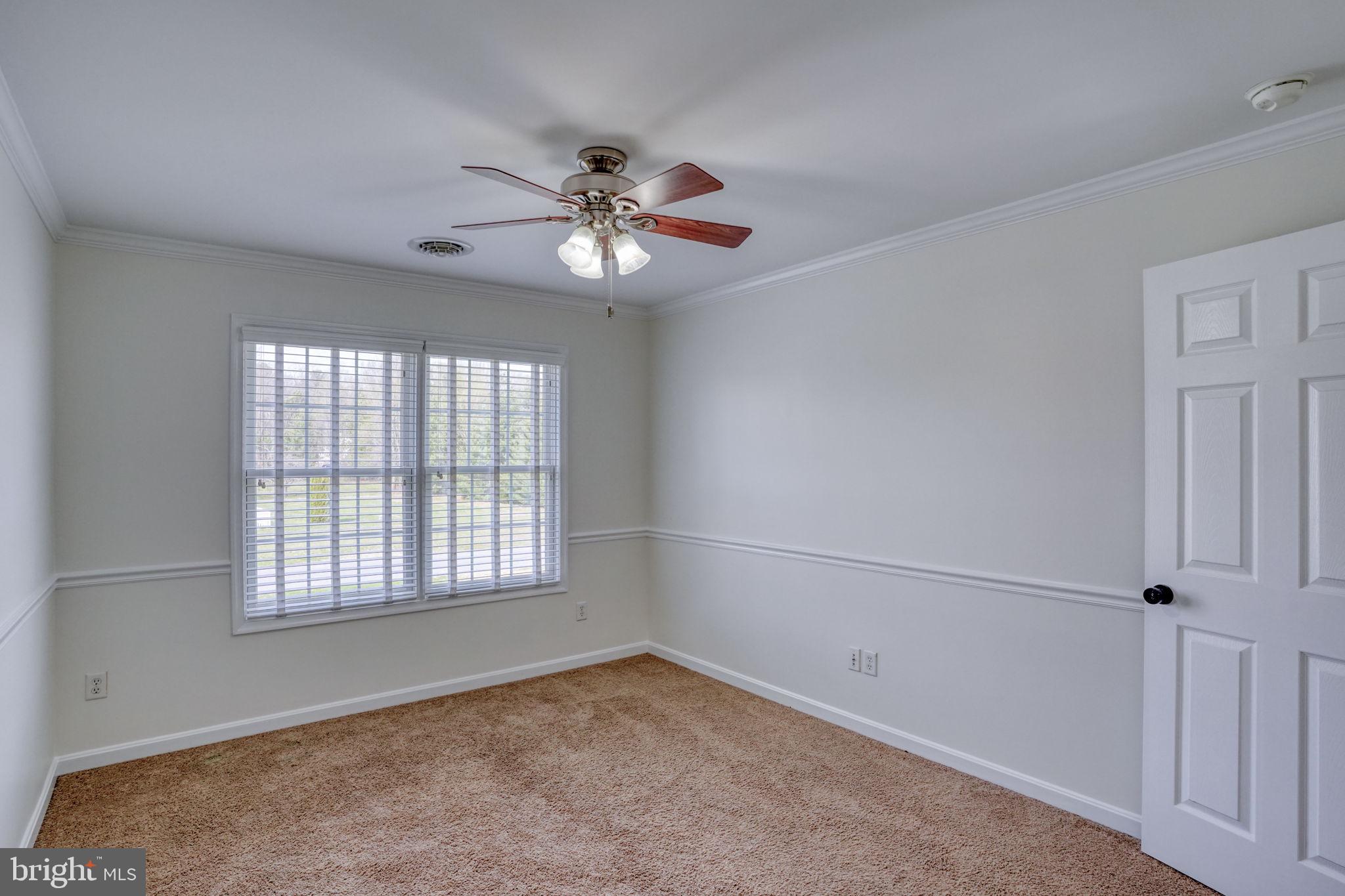 210 Grapevine Way Milford, DE 19963 - Photo 52 of 61 a view of an empty room with a window