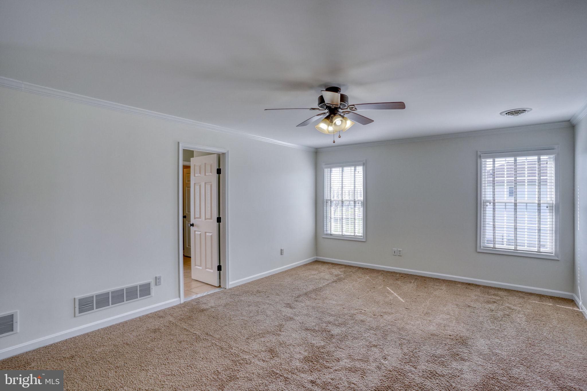 210 Grapevine Way Milford, DE 19963 - Photo 54 of 61 a view of an empty room with a window