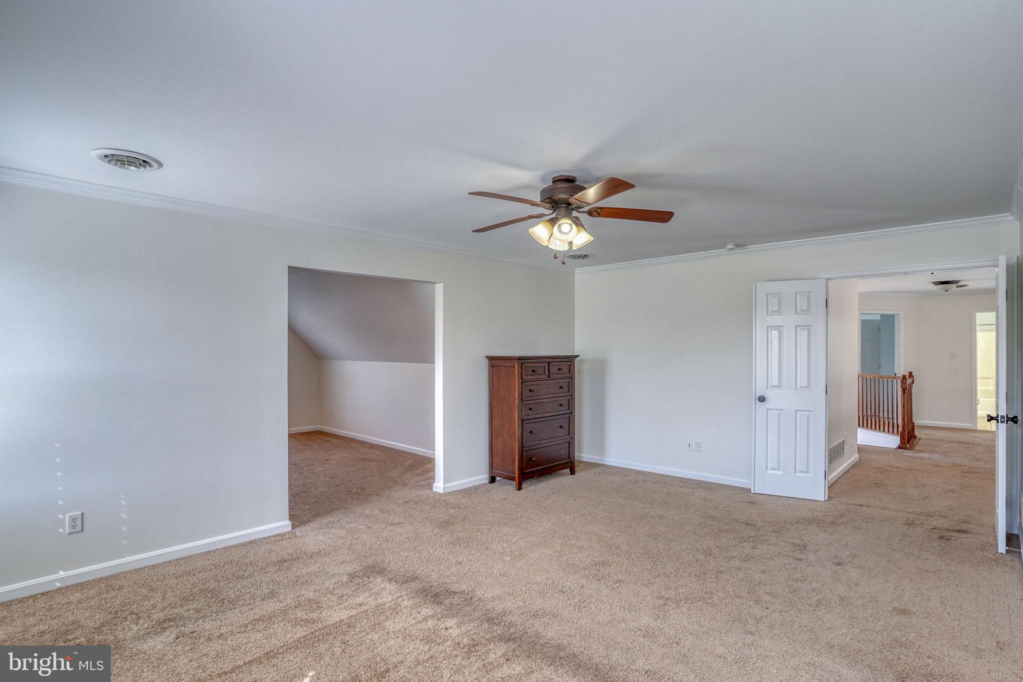 210 Grapevine Way Milford, DE 19963 - Photo 55 of 61 a view of an empty room with a chandelier fan