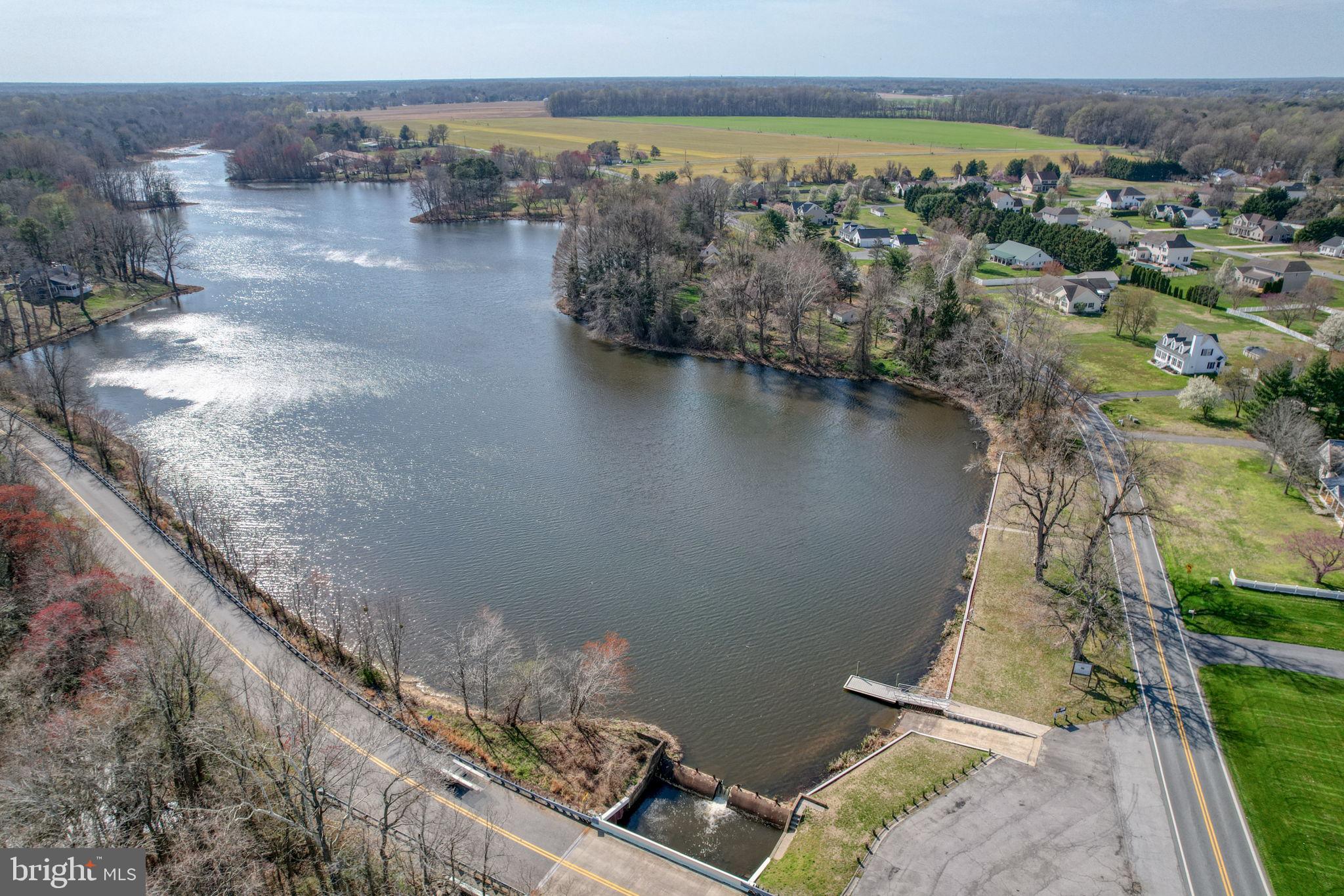 210 Grapevine Way Milford, DE 19963 - Photo 6 of 61 a view of a lake with a mountain