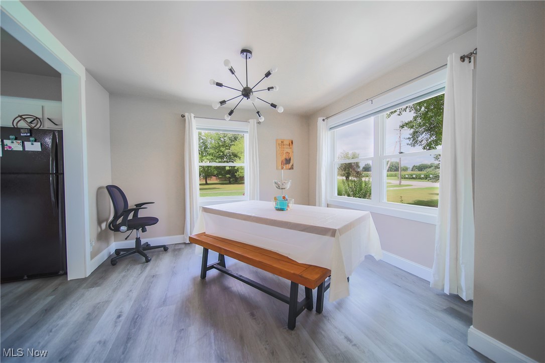 3181 Dover Road Wooster, OH 44691 - Photo 8 of 25 Dining area featuring plenty of natural light and hardwood / wood-style floors