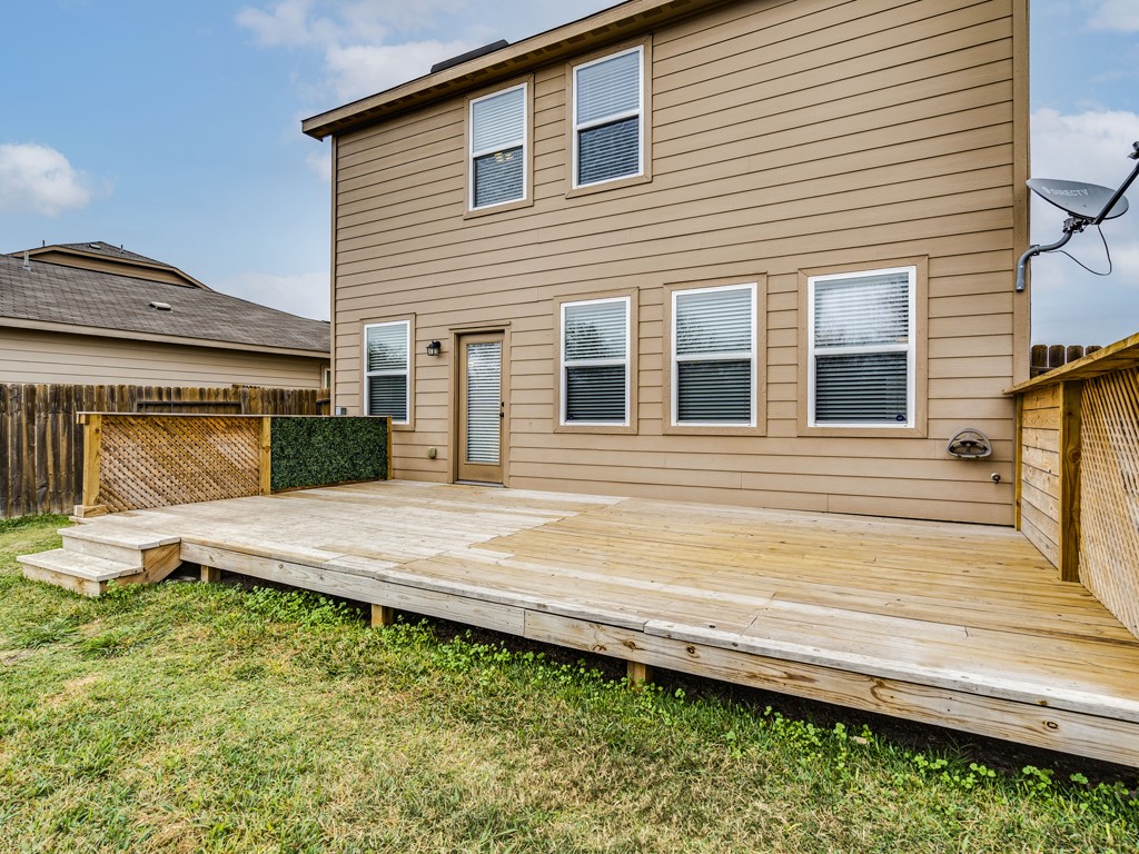 216 Isabel Lane Kyle, TX 78640 - Photo 24 of 27 a view of a house with a wooden fence