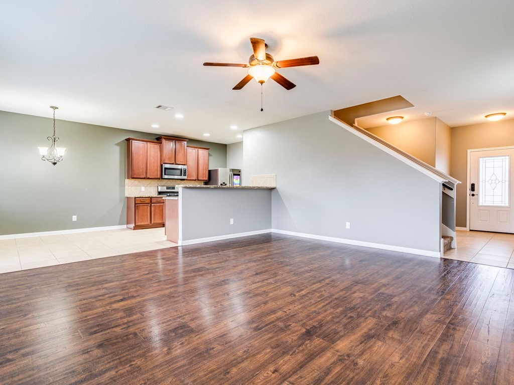 216 Isabel Lane Kyle, TX 78640 - Photo 7 of 27 a view of a kitchen with a sink and a microwave