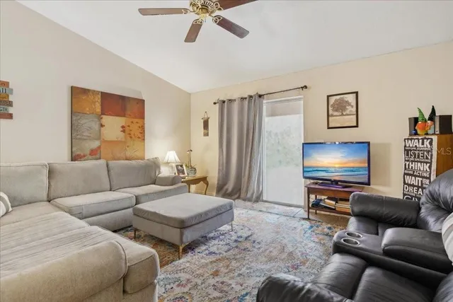 a bedroom with a bed and a couch