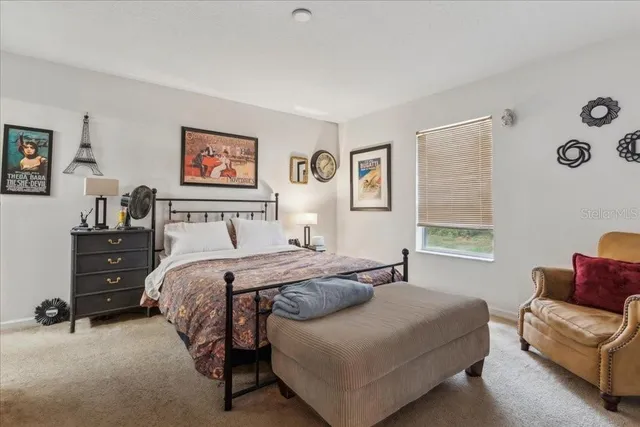 a bedroom with a bed and a view of bathroom