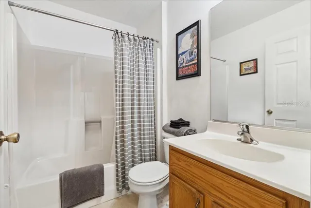 a bedroom with furniture and a bed