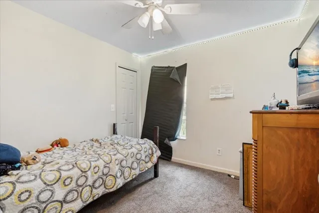 a bed room with furniture and a window