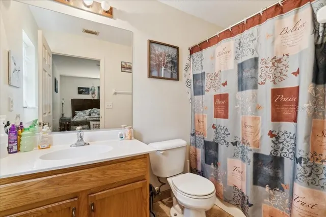 a view of a hallway view with furniture and wooden floor