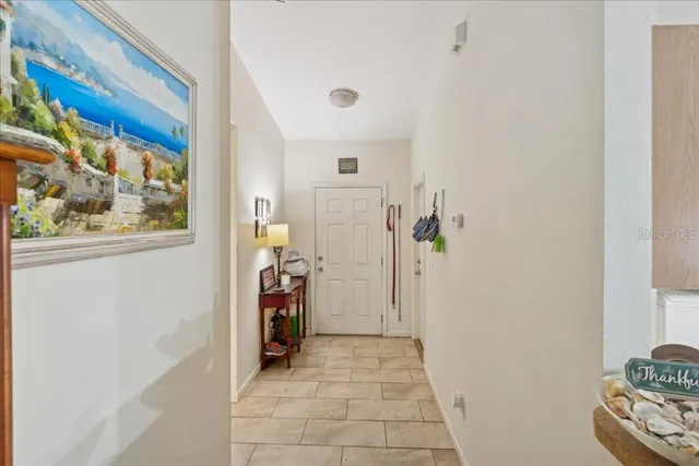 a view of a hallway with paintings on the wall