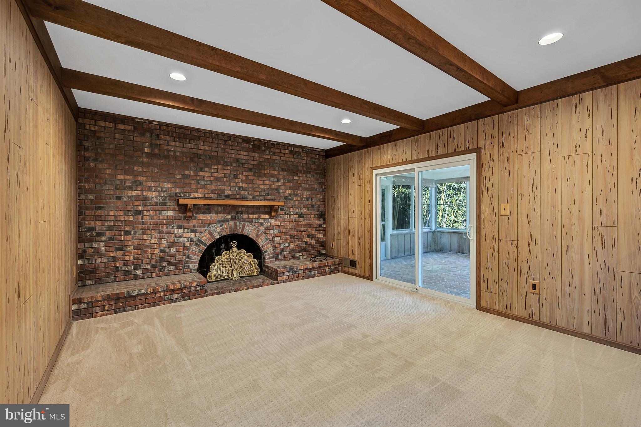 8617 Atwell Road Potomac, MD 20854 - Photo 14 of 39 a view of a big room with closet and fireplace