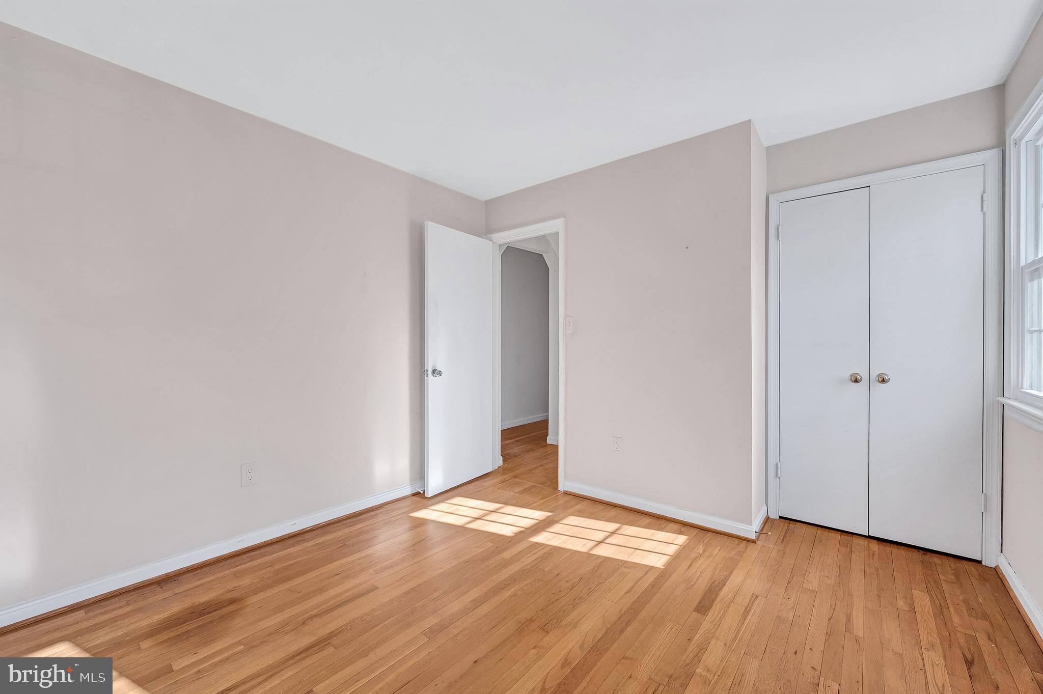 8617 Atwell Road Potomac, MD 20854 - Photo 24 of 39 a view of an empty room with wooden floor