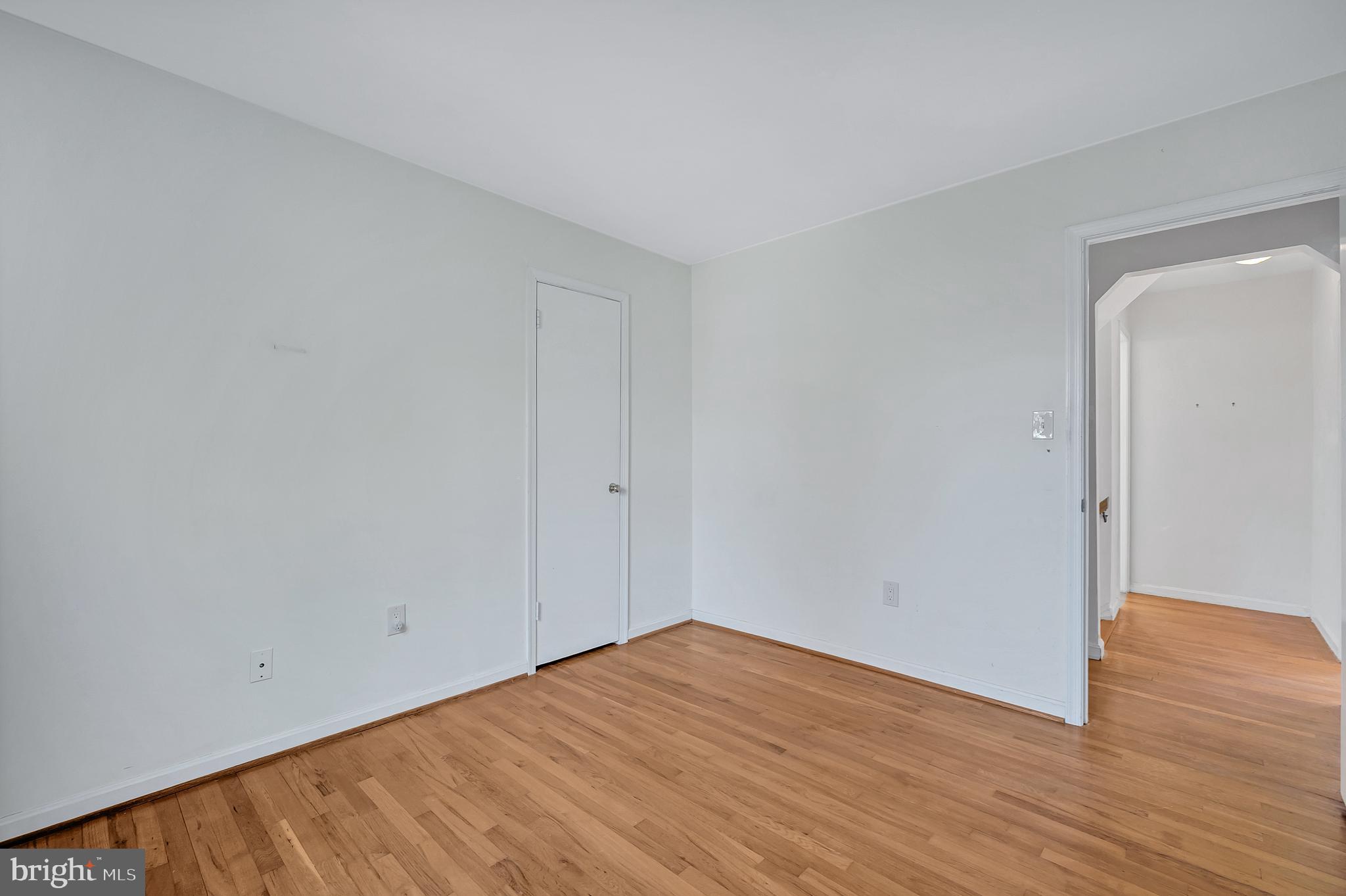 8617 Atwell Road Potomac, MD 20854 - Photo 33 of 39 a view of empty room with wooden floor