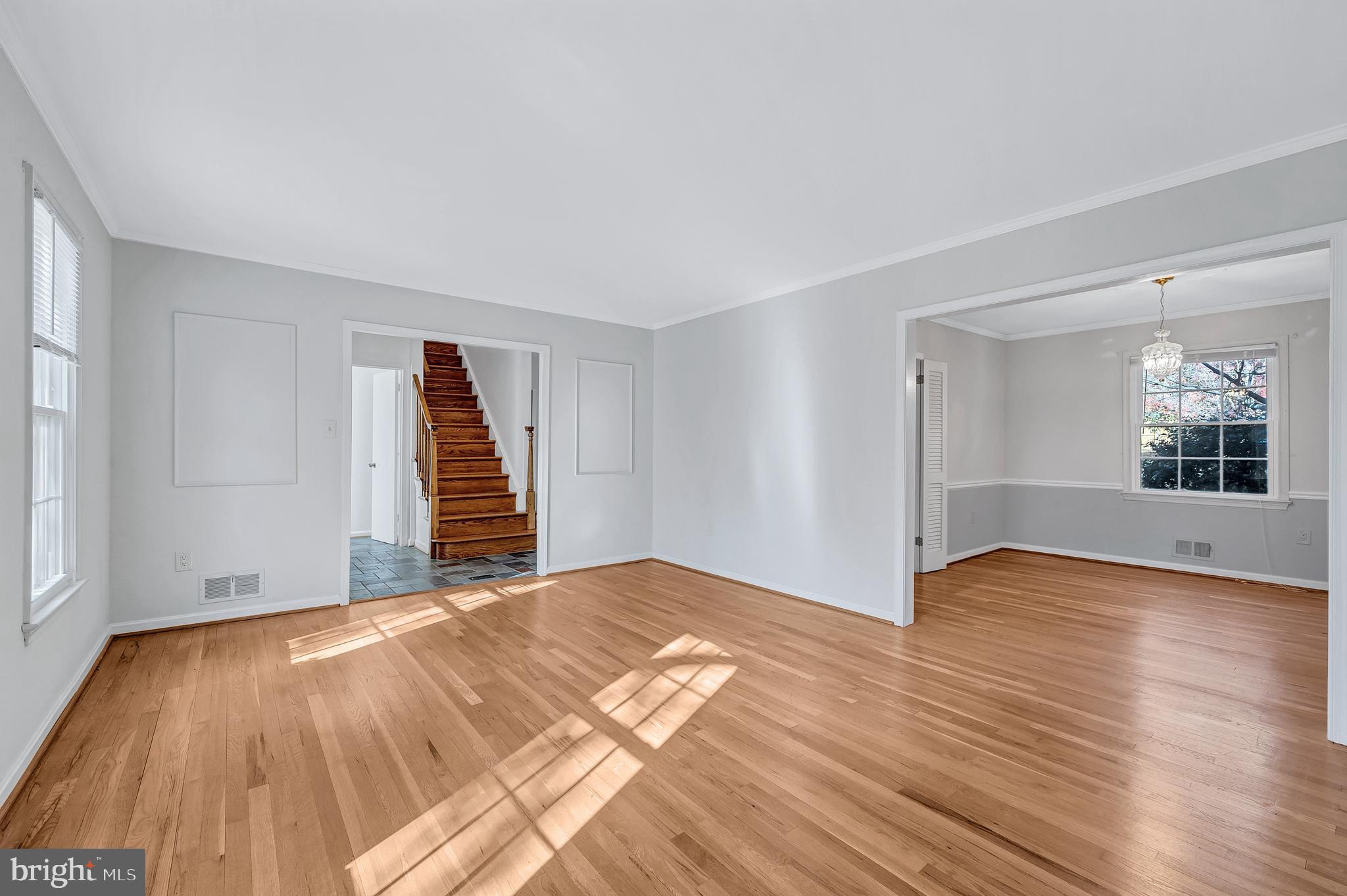 8617 Atwell Road Potomac, MD 20854 - Photo 4 of 39 a view of an empty room with wooden floor and a window