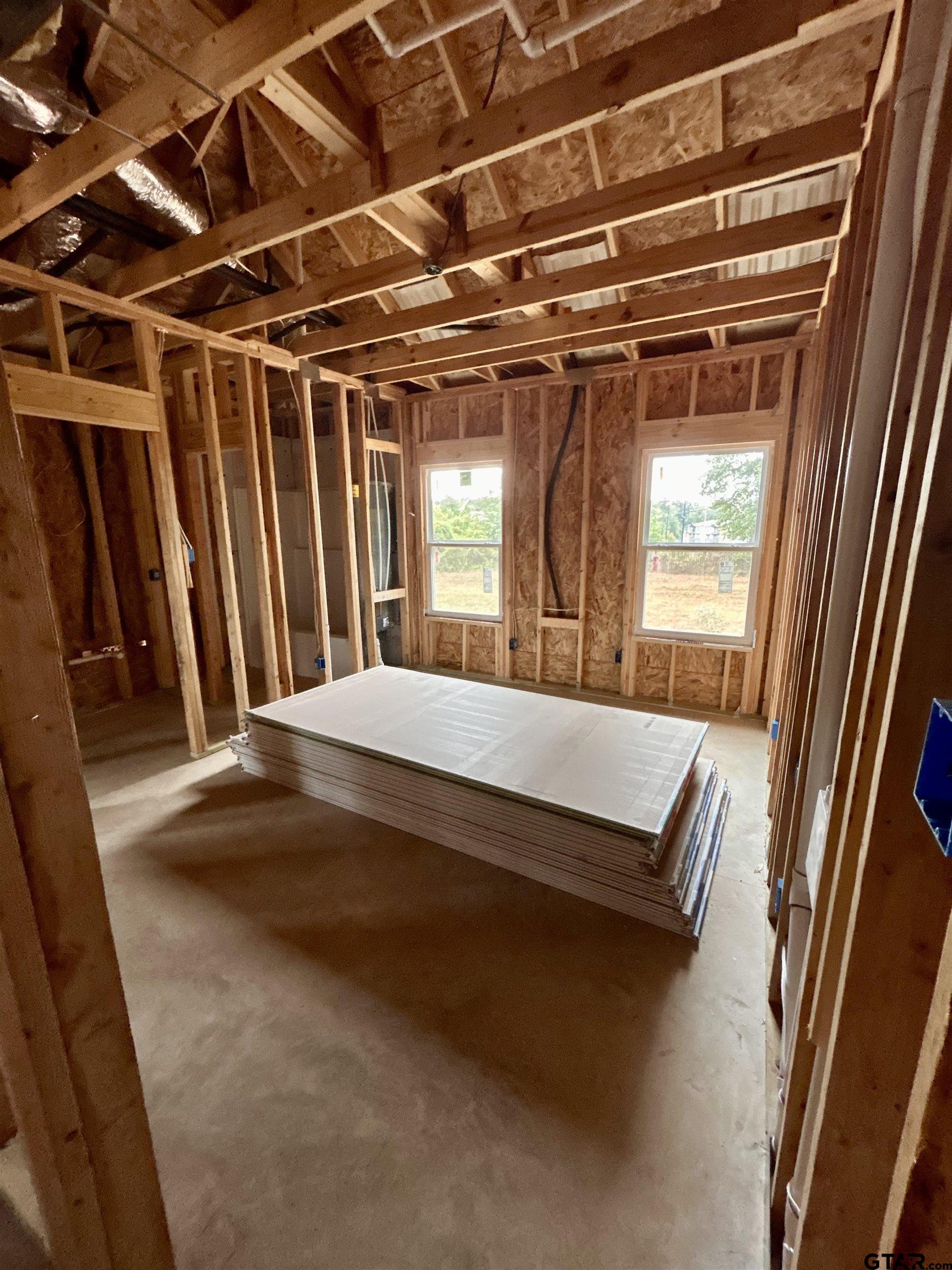 614 Oak Street Longview, TX 75605 - Photo 4 of 10 a view of walk in closet with clothes and shoes