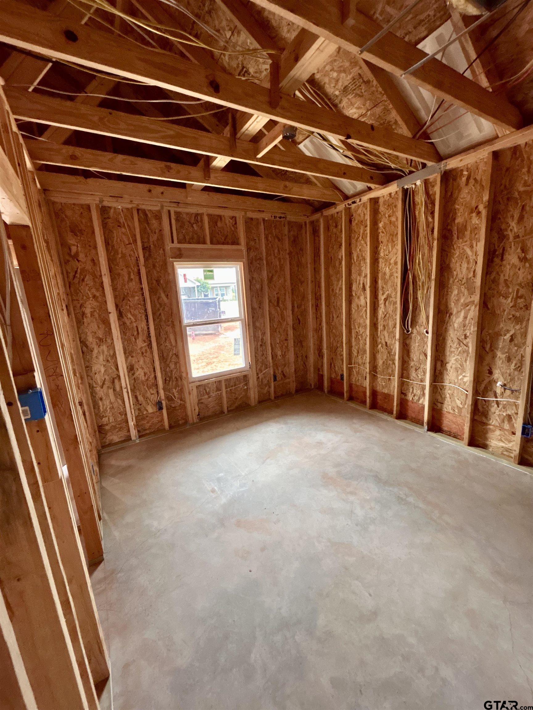 614 Oak Street Longview, TX 75605 - Photo 9 of 10 a view of an empty room with a window