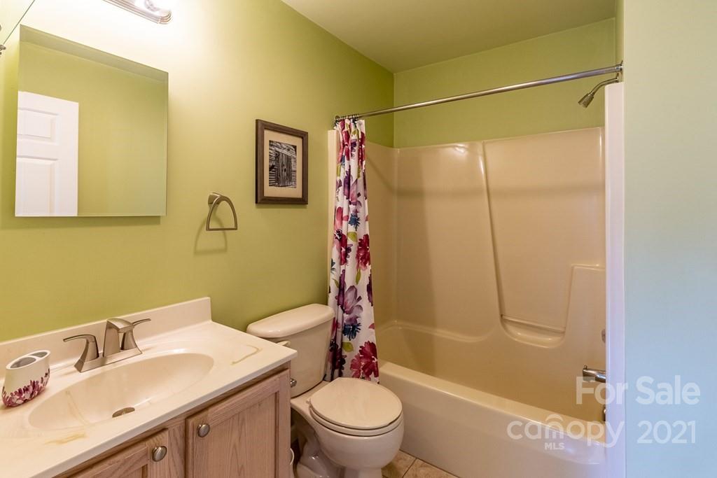 30 Ridge Point, Unit 1 Sylva, NC 28779 - Photo 14 of 42 a bathroom with a sink a toilet and shower