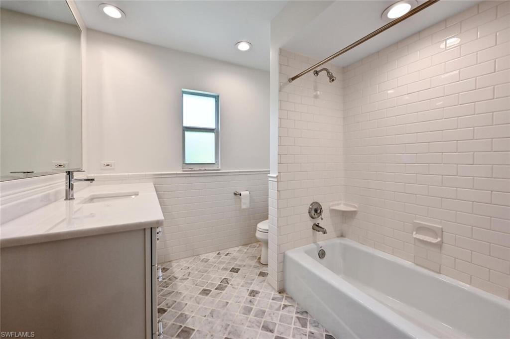 508 Devils Lane Naples, FL 34103 - Photo 22 of 35 a bathroom with a sink a toilet and shower