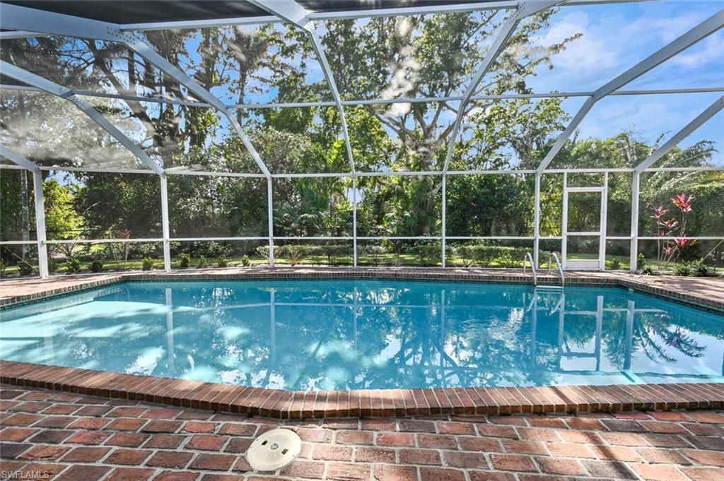 508 Devils Lane Naples, FL 34103 - Photo 28 of 35 a view of a wooden deck with a yard