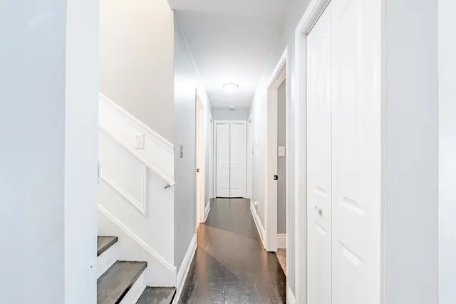 a view of a hallway with staircase
