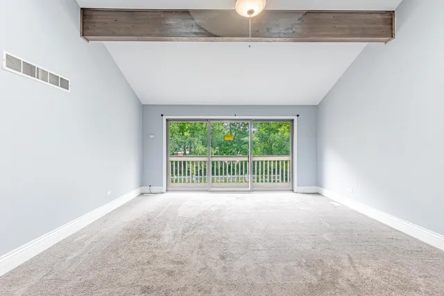 a view of a room with a large window