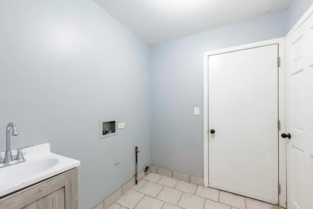 a bathroom with a sink toilet and vanity