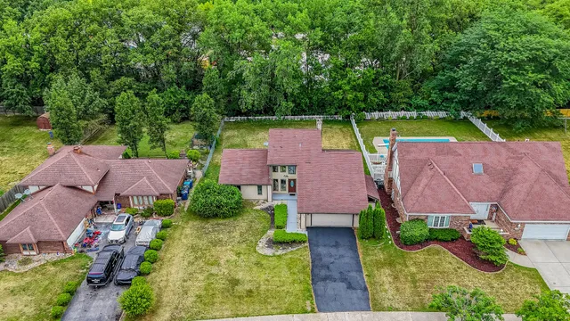 an aerial view of house with a swimming pool yard and outdoor seating
