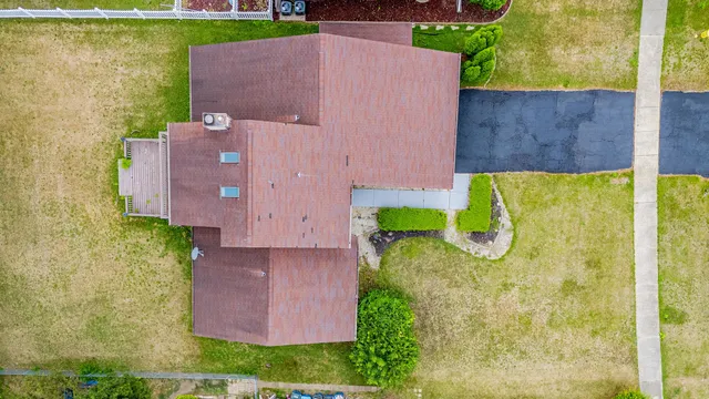 an aerial view of a house with a garden