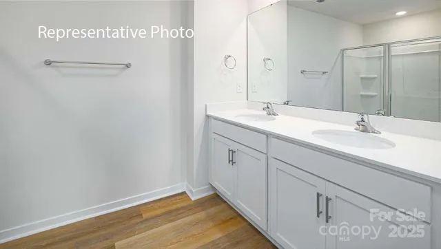 a bathroom with a sink and mirror