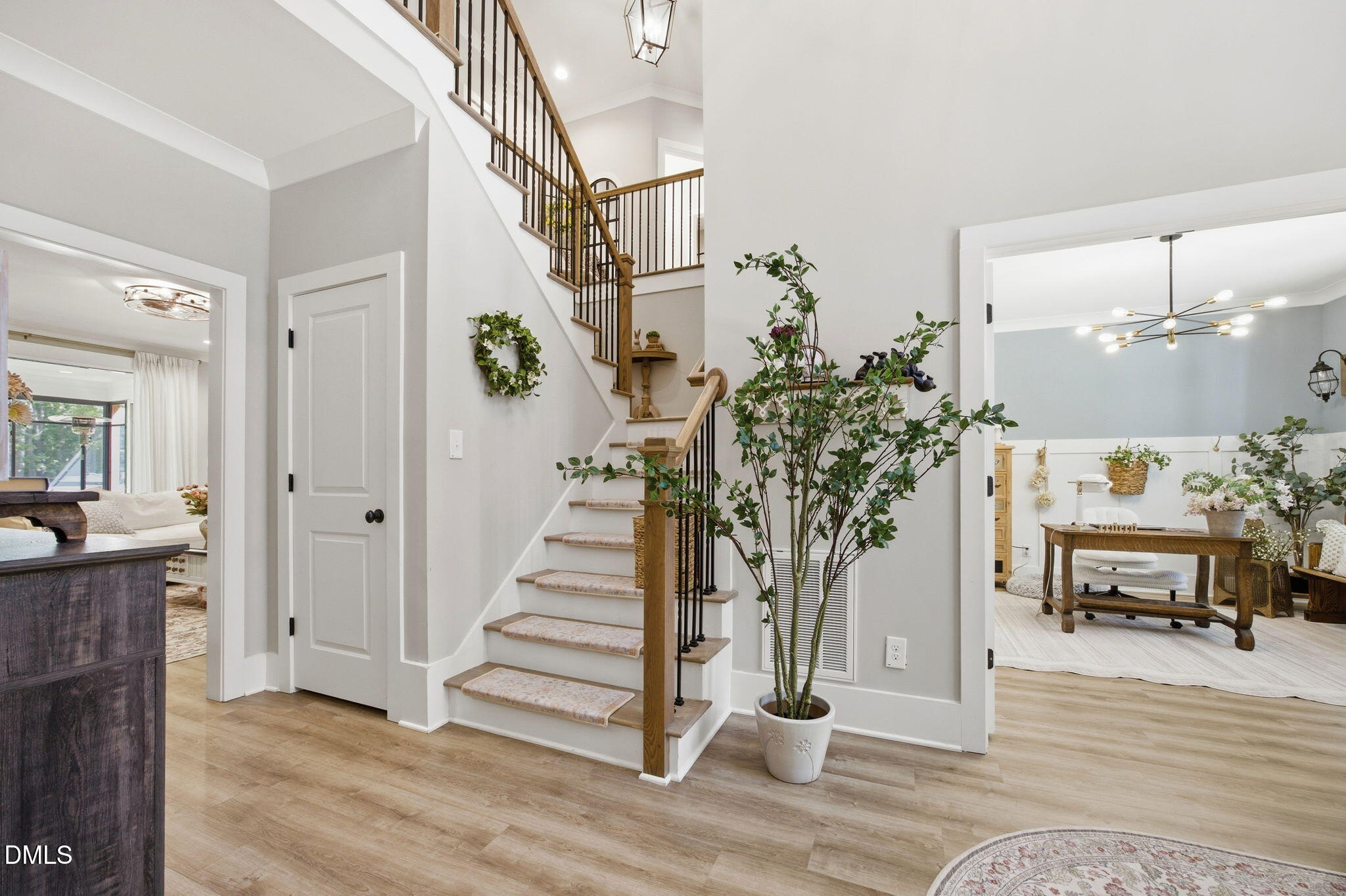 3511 Bruce Garner Road Wake Forest, NC 27587 - Photo 5 of 56 a view of a hallway with wooden floor fireplace and dining room
