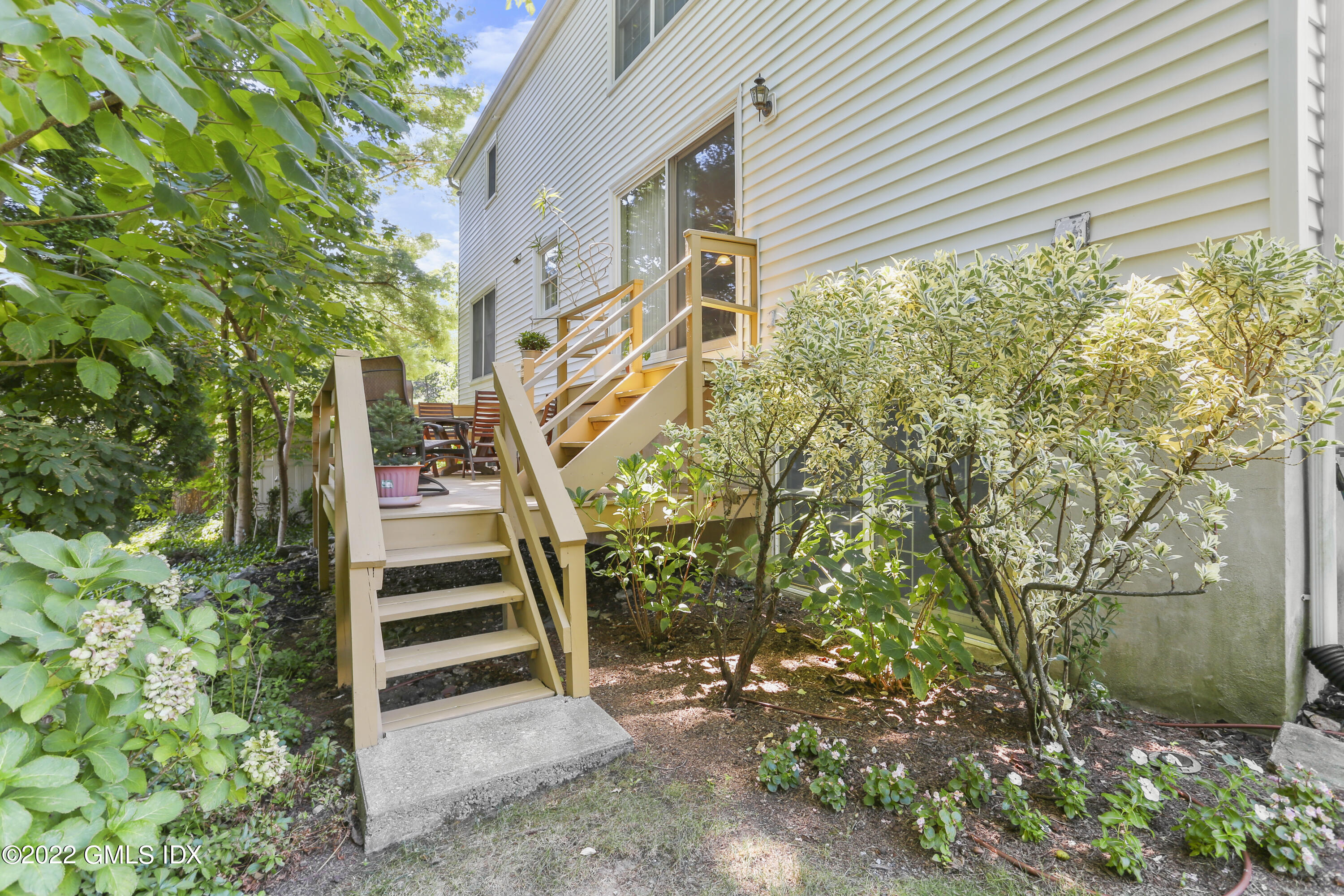 51 Indian Field Road Greenwich, CT 06830 - Photo 23 of 26 a backyard of a house with lots of green space
