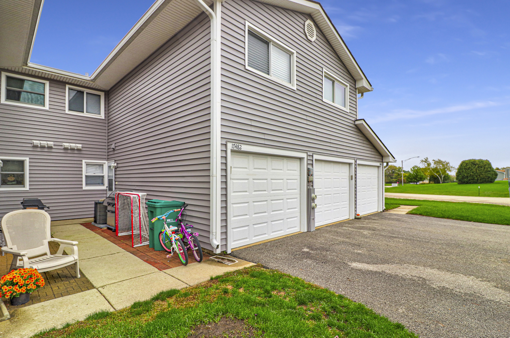 17482 Chestnut Lane Gurnee, IL 60031 - Photo 2 of 23 a view of backyard with a chair and tables