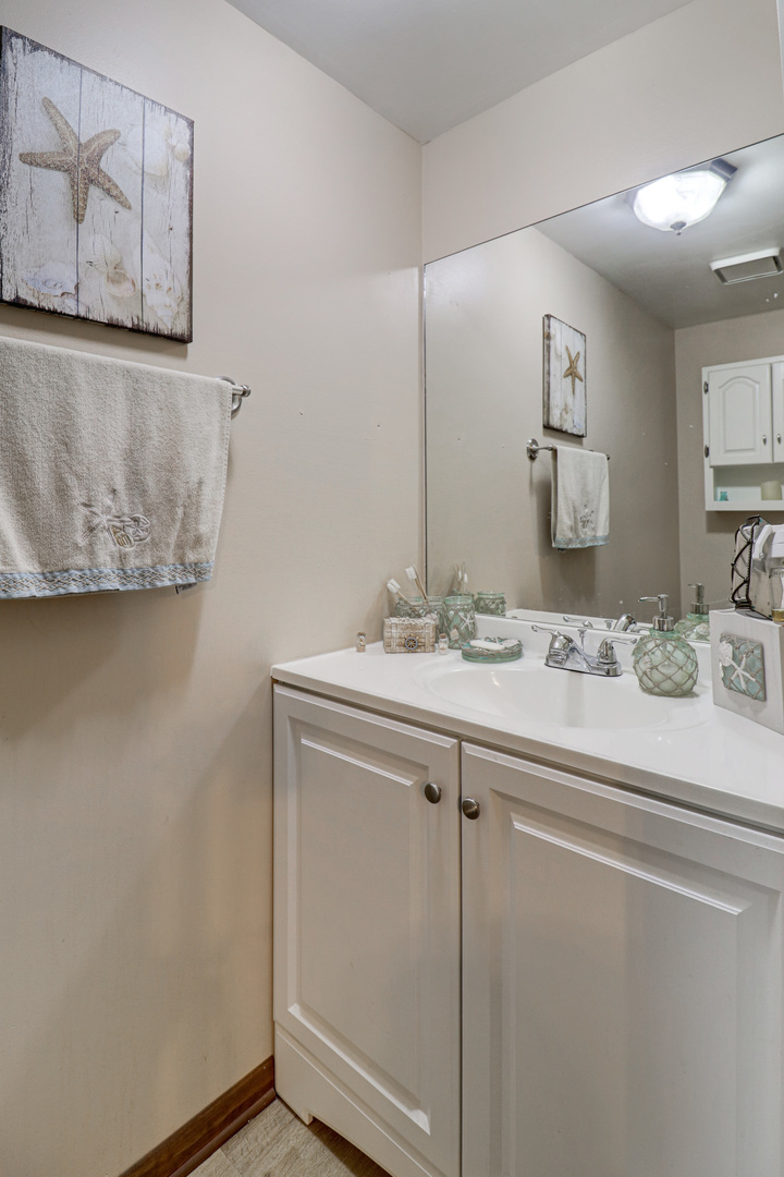17482 Chestnut Lane Gurnee, IL 60031 - Photo 6 of 23 a bathroom with a sink and a mirror