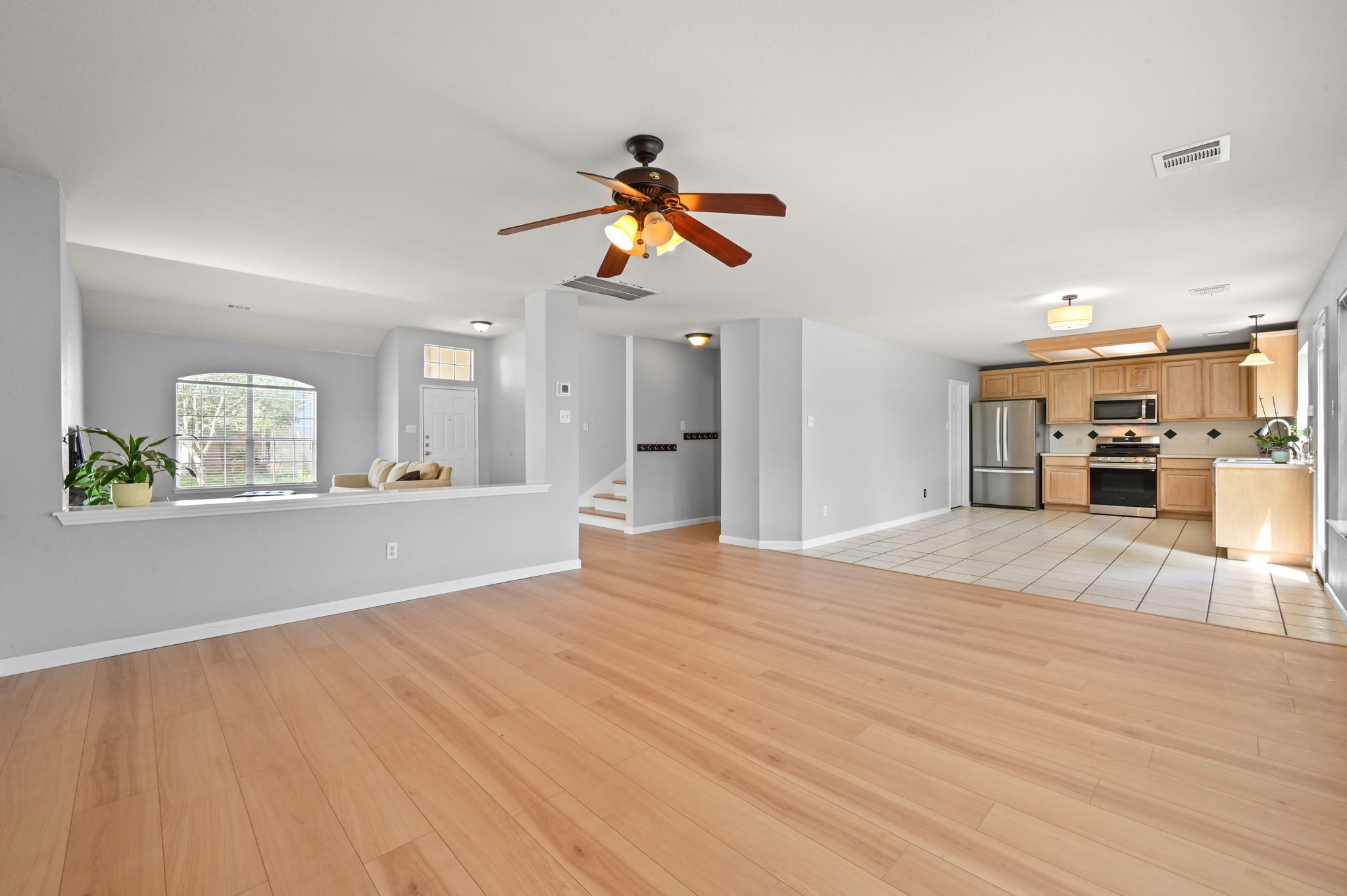 2700 Cradlerock Terrace Austin, TX 78748 - Photo 12 of 29 a view of a kitchen with wooden floor and a window