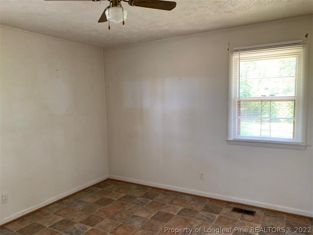 2681 Raynham Road Fairmont, NC 28340 - Photo 8 of 10 an empty room with a window