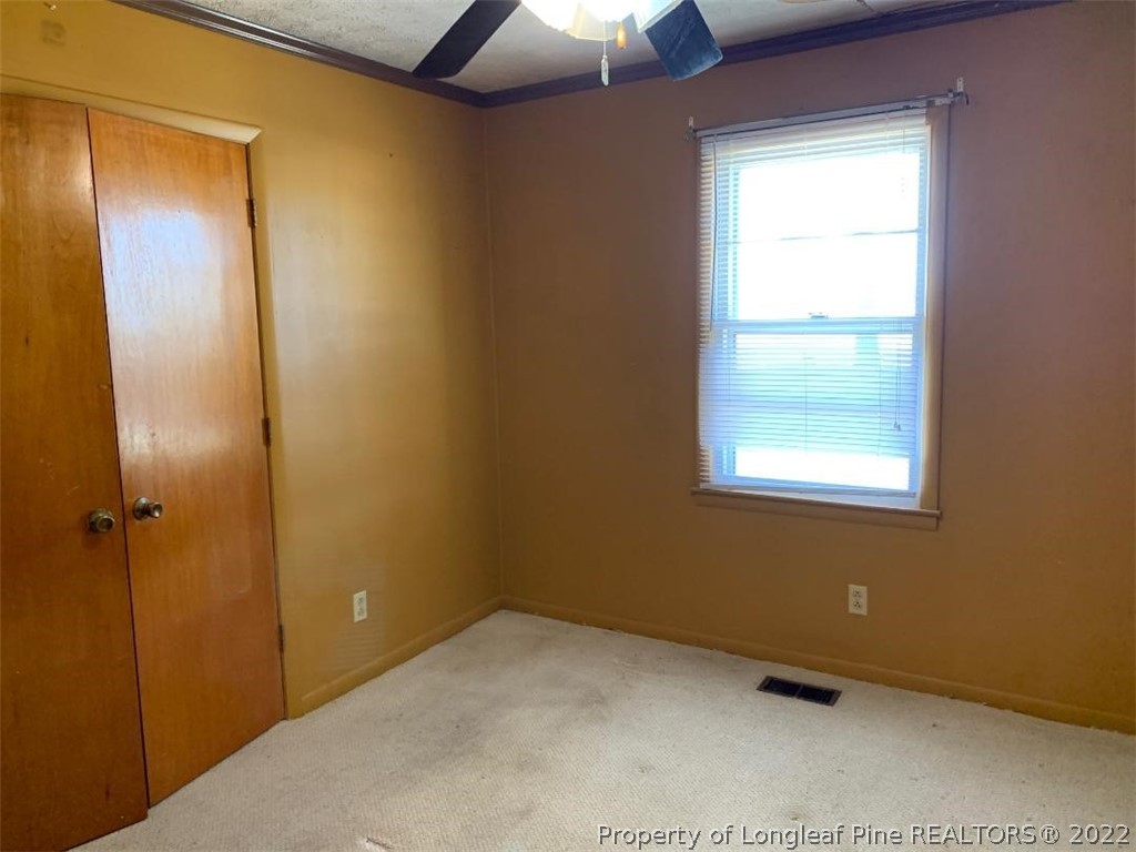 2681 Raynham Road Fairmont, NC 28340 - Photo 9 of 10 an empty room with a window