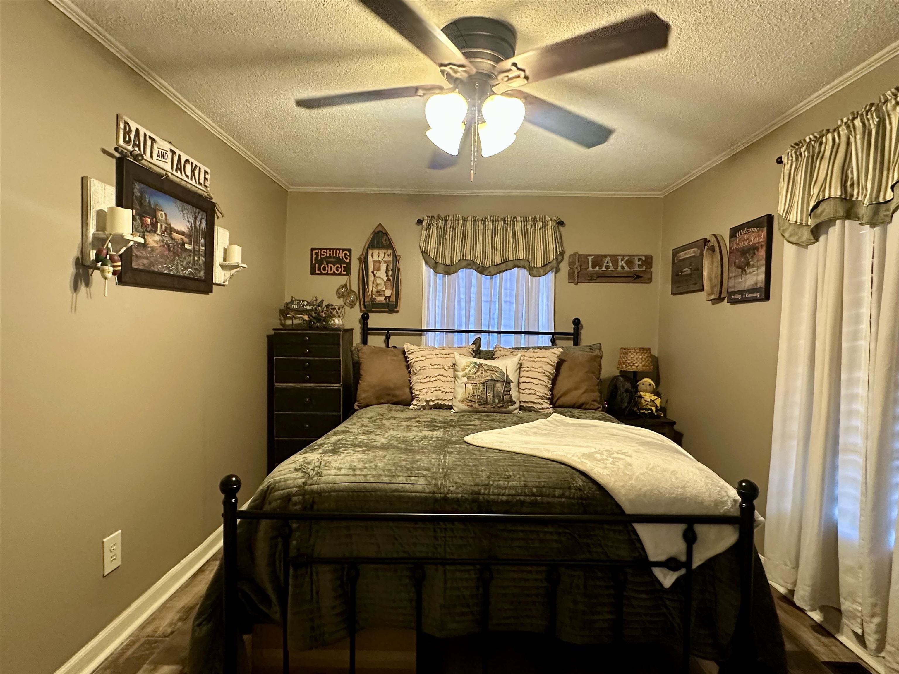 4769 Pleasant Site Road Selmer, TN 38375 - Photo 20 of 28 a bed sitting in a bedroom next to a window