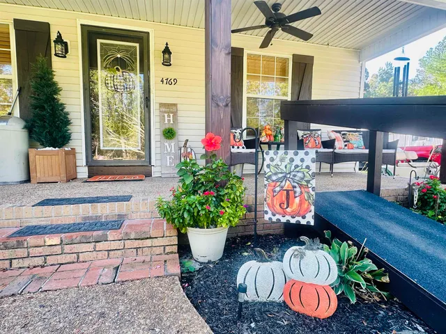 a outdoor dining space with furniture and potted plants